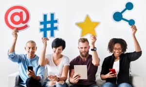 People holding an social media icon